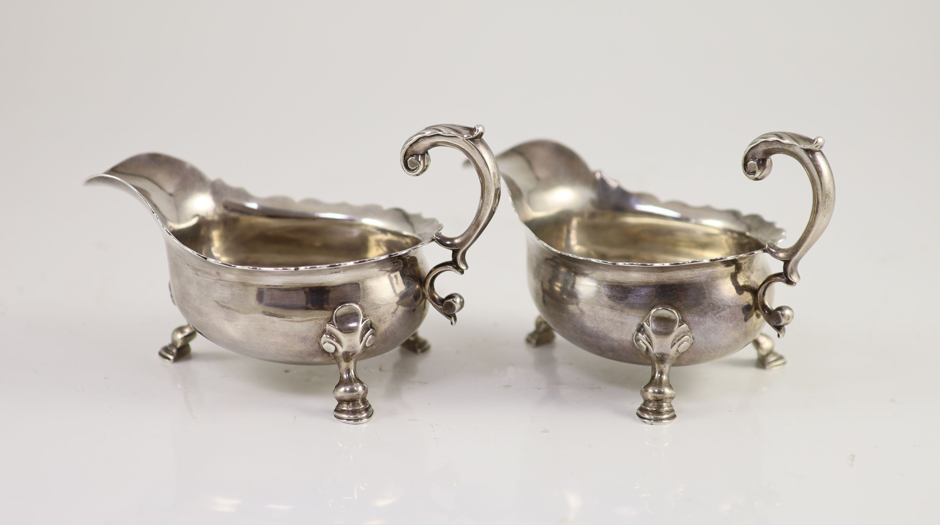 A pair of George II silver sauceboats, by Henry Brind